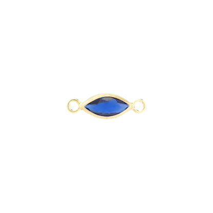 A gold-filled marquise-shaped connector charm with a dark blue faceted gemstone in the center and two small loops on either end, shown on a plain white background.