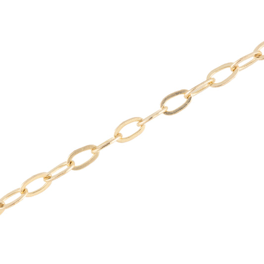 A close-up of a gold paperclip chain link necklace on a solid white background.