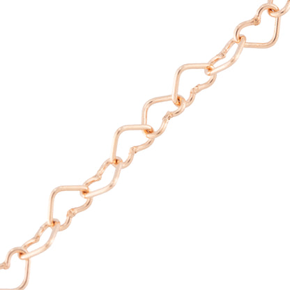 A close-up of a rose gold chain link bracelet featuring interlocking open heart shapes, shown against a plain white background.